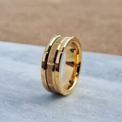 This 8mm Gold Tungsten Ring features