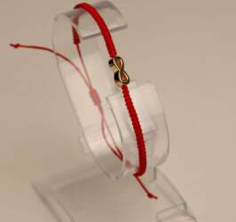 Red thread bracelet with small infinity