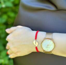 Red thread bracelet with a quotation