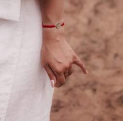 Red thread bracelet with tree of
